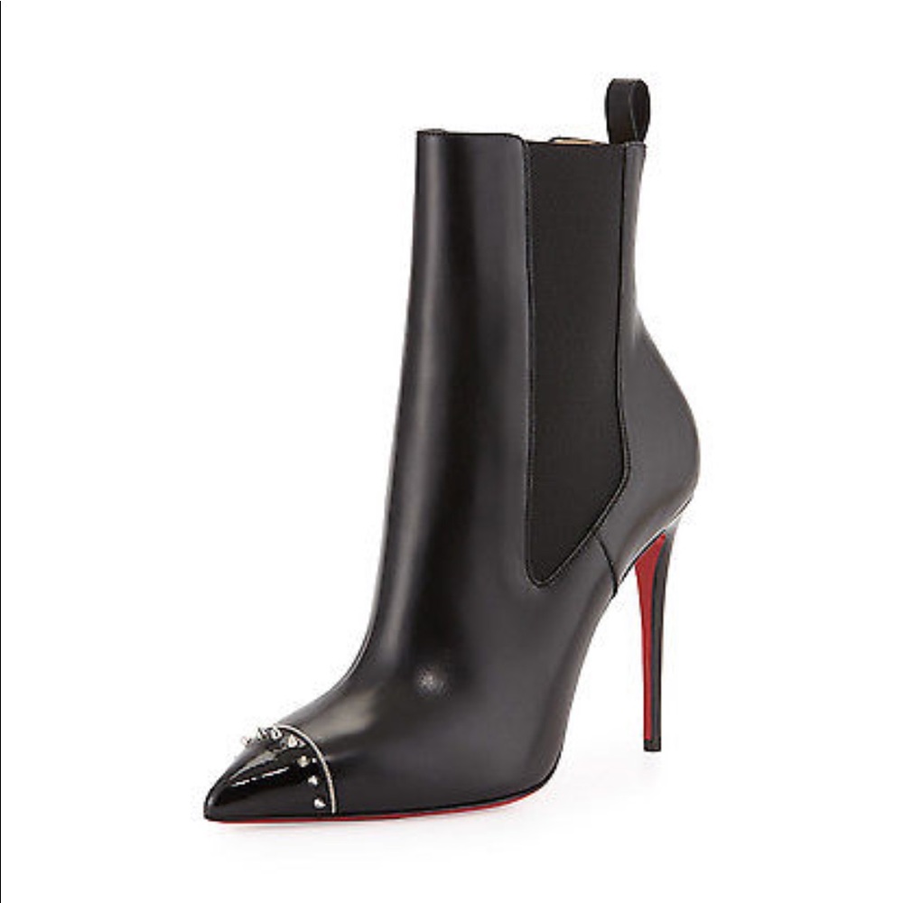 Christian Louboutin‘s.   Black booties